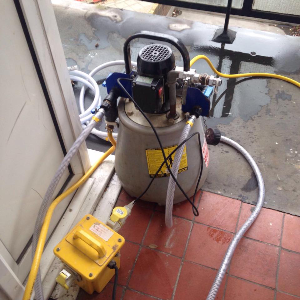 Dirty central heating water full of sludge during power flush in Surrey